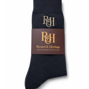 Grey sock with a brown label featuring 'R&H' branding on a white background