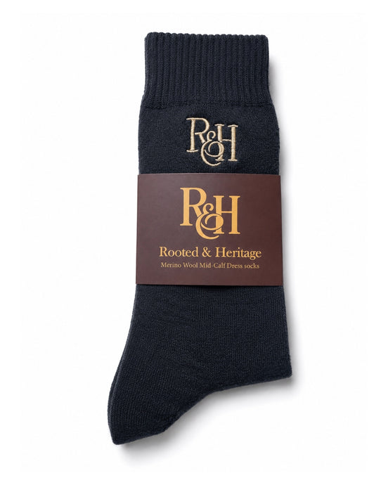 Grey sock with a brown label featuring 'R&H' branding on a white background
