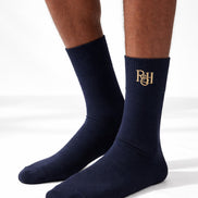 Navy socks with a logo on a white background