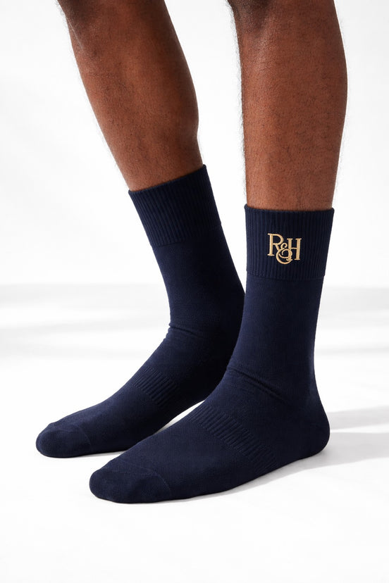 Navy socks with a logo on a white background