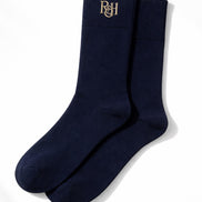 Pair of navy socks with a logo on a white background