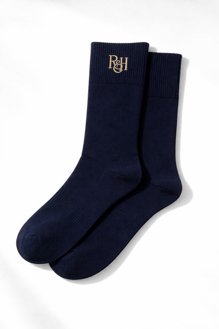 Pair of navy socks with a logo on a white background