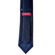 Navy blue tie with a pink label on a white background