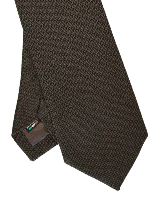 A close-up of a dark brown textured necktie with a small brand tag visible near the tip, set against a plain white background.