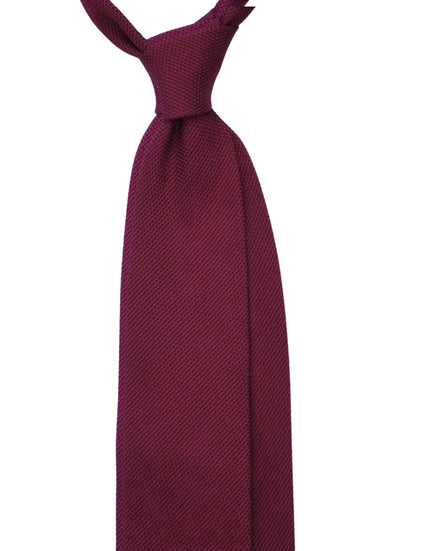 Maroon tie on a white background