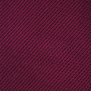 Close-up of a textured purple fabric with a diagonal pattern