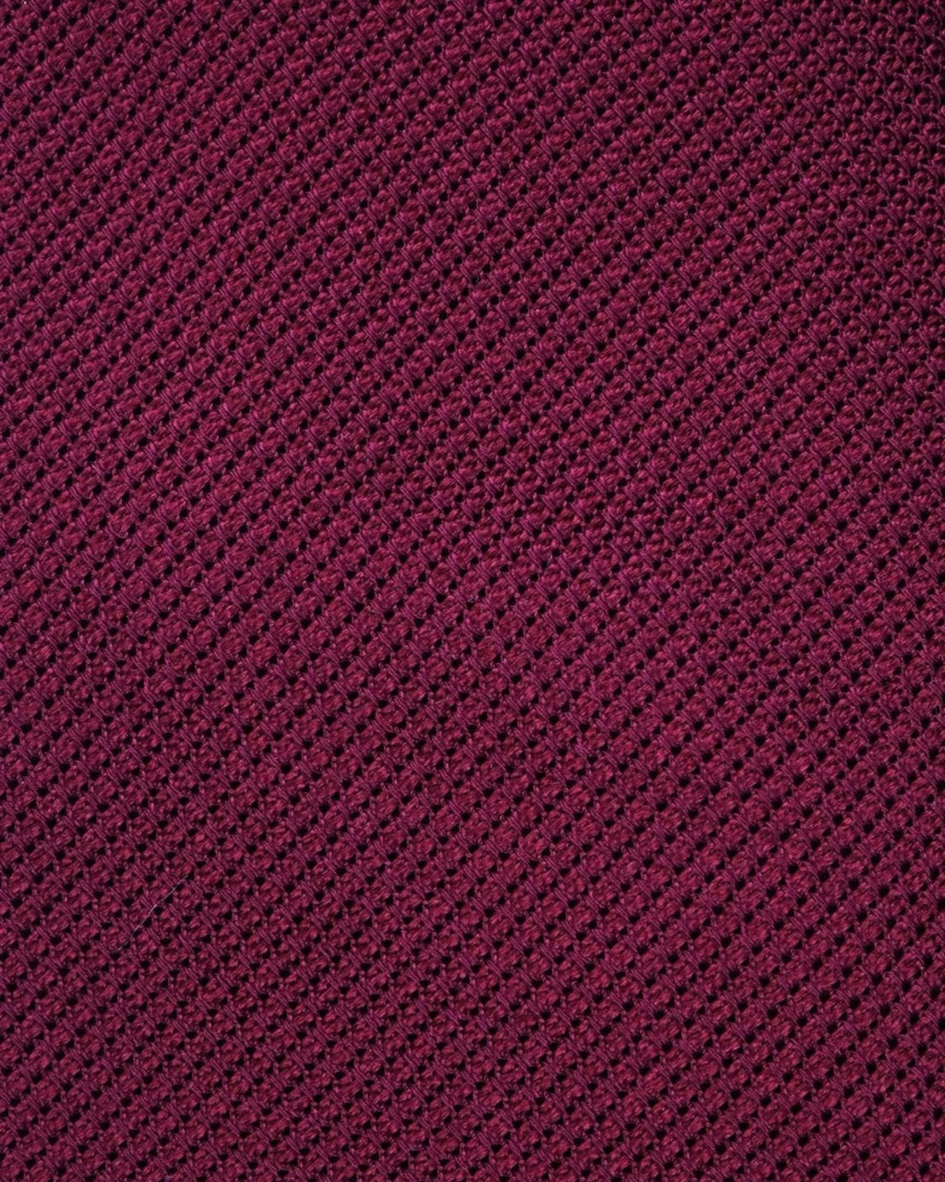 Close-up of a textured purple fabric with a diagonal pattern