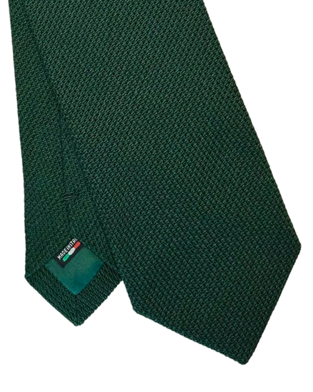 A dark green textured necktie with a small green brand tag showing the brand name 'Mazzucchelli'.