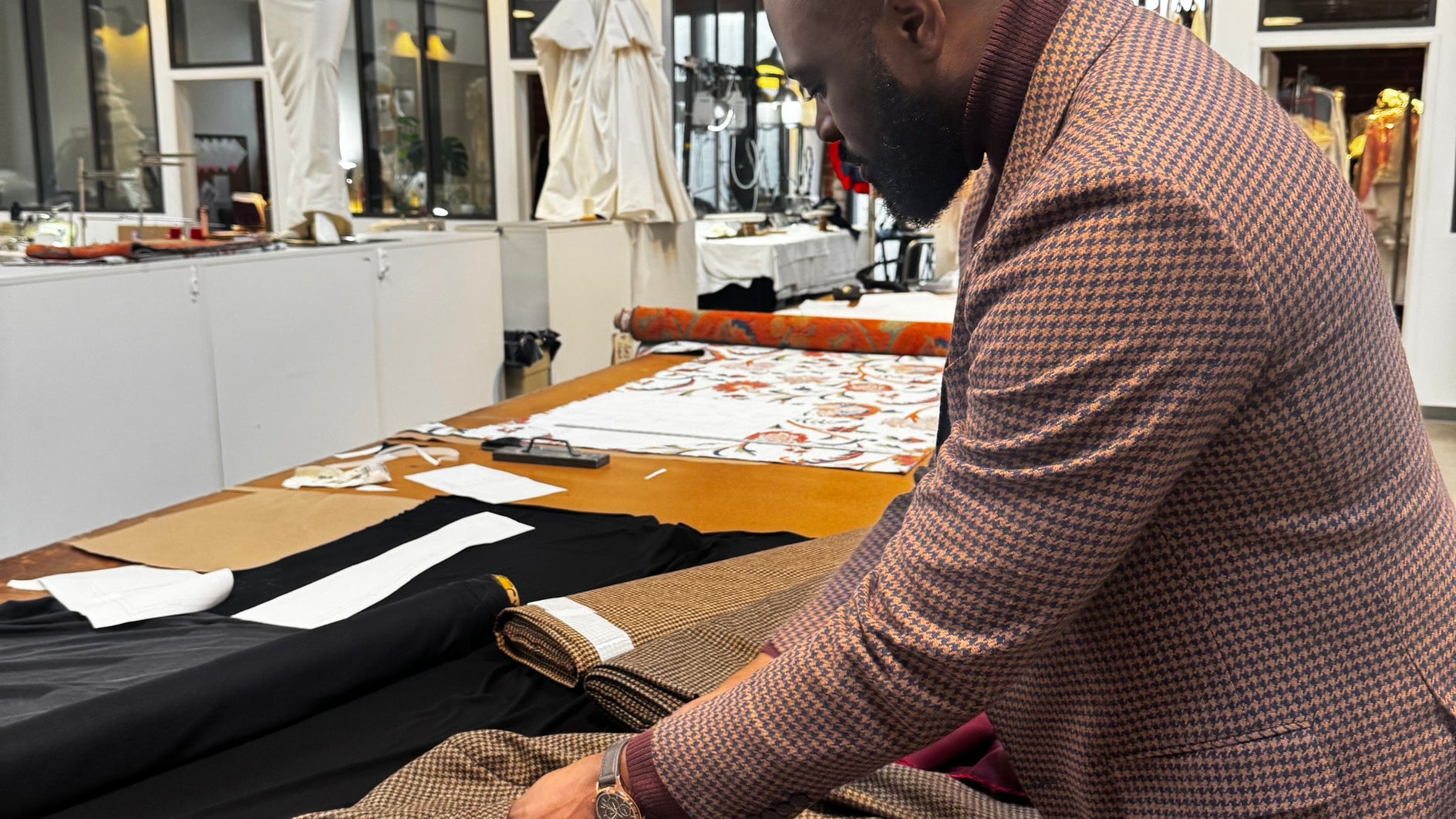 Person working with fabric in a workshop setting