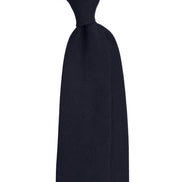 Navy blue tie on a white background